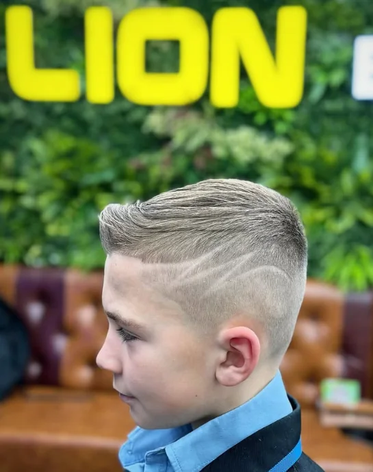 Kids fade with a shaved line design at Lion Barbers