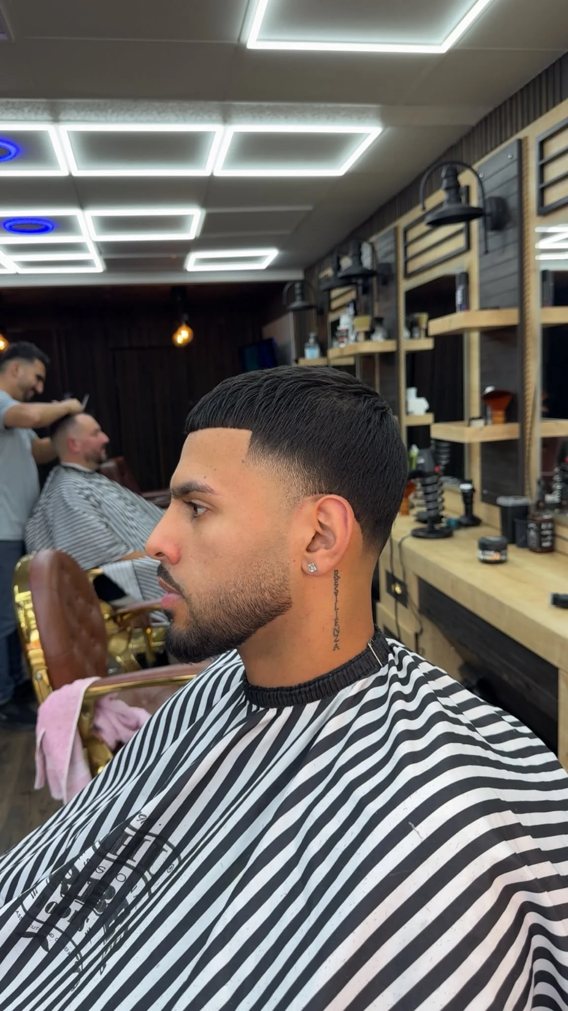 Sharp skin fade with a precisely shaped beard at Lion Barbers