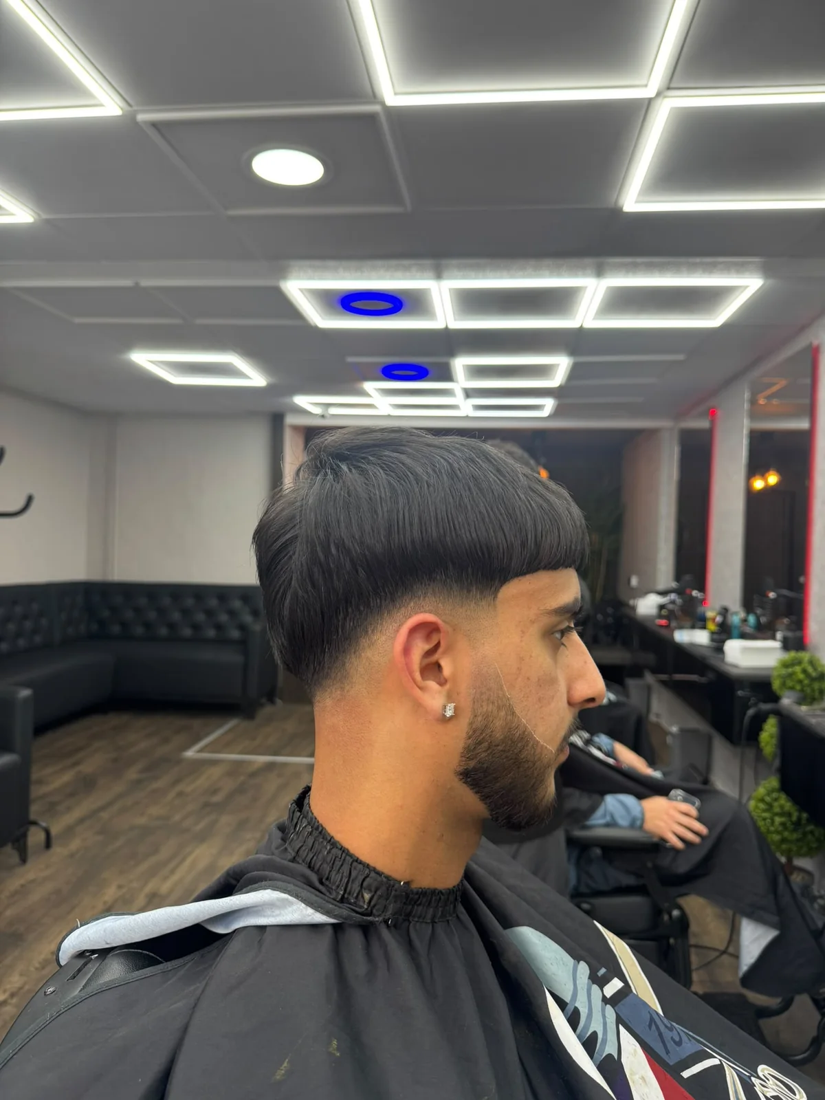 Textured fringe with a clean fade and beard line-up